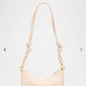 SIMKHAI 

Avery Curved Leather Crossbody Bag